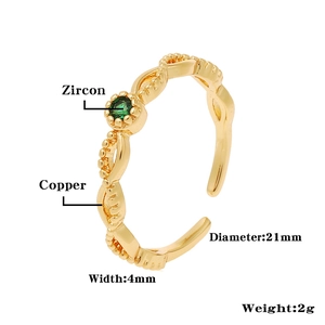 Detail showing an adjustable copper crown ring with green zircon and 4mm width dimension