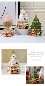 Detailed view of ceramic Christmas tree trinket boxes with bear relief and golden star lid