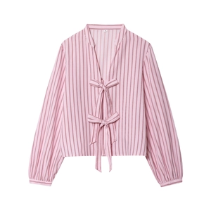 Front view of pink striped long sleeve poplin shirt featuring bow tie front details