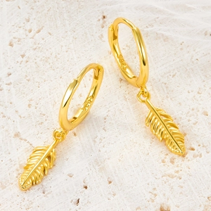 Exquisite 925 sterling silver hoop earrings with gold feather charms on white marble
