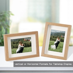 Close-up of solid wood photo frames in vertical and horizontal tabletop display formats