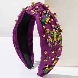 Serre-tête violet de Mardi Gras orné de perles, strass et décorations de masques festifs