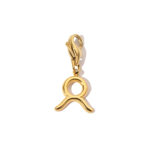 Detail shot of a 14K gold-plated Taurus zodiac pendant with lobster clasp on white background