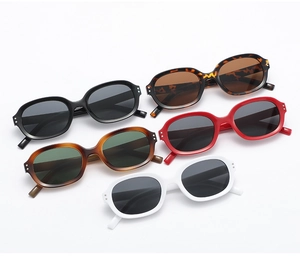Detail view of retro oval sunglasses with metal rivet accents in five stylish colors