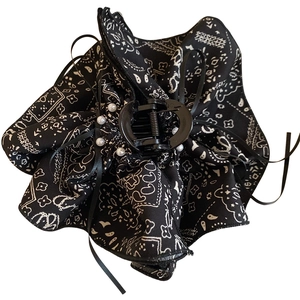 Floral fabric shark clip with pearls and ribbon tassel in classic monochrome pattern