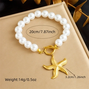 Detail view of pearl bracelet with starfish charm showing dimensions 20cm and weight 14g