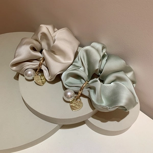 Elegant silk hair scrunchies in beige and light green with pearl and gold heart charms