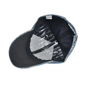 Internal view of hip-hop cotton cap showing wash label and transparent brim shaper