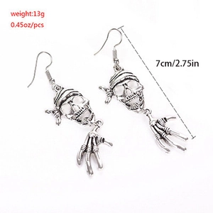 Detail view of pirate skeleton hand earrings with 7cm length and 13g weight