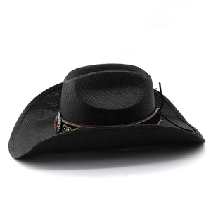 Detailed close-up of black straw cowboy hat with ethnic embroidery and gem band