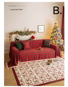 Close-up of red and green plaid Christmas sofa cover with decorative edge fringe