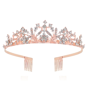 Detail of rose gold alloy bridal crown with sparkling white rhinestones and side hair combs