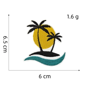 Macro shot of tropical island embroidery patch showing palm tree and sunset details