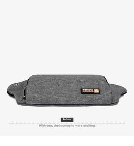 Close-up of the grey Oxford fabric bottom and brand label on the sports waist bag