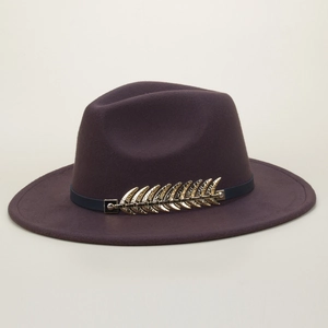 Detailed view of dark purple wool fedora hat featuring an elegant gold metallic leaf