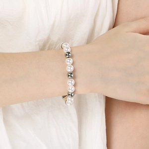 Close-up of a beaded bracelet with white imitation pearls and silver stainless steel beads