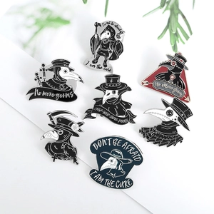 Group display of plague doctor enamel pins in gothic dark style with crow and skull motifs