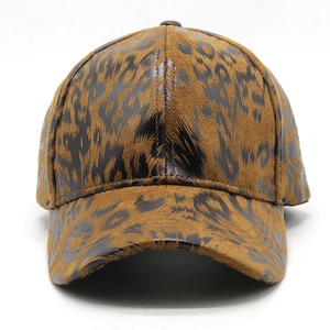 Detail of leopard print baseball cap featuring faux leather and velvet patchwork texture