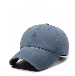 Detail view of washed grey cotton baseball cap with ventilation holes and stitch lines