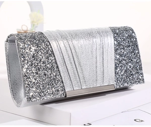 Detail view of silver sequin evening clutch bag with metallic frame and envelope flap cover