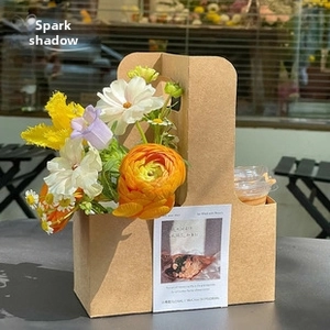 Artistic kraft paper flower basket and drink holder with elegant mixed floral bouquet