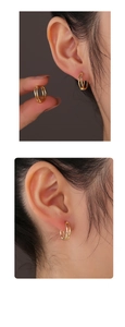 Close-up of elegant 14K gold plated double hoop earrings with a polished metallic finish