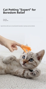 Mini silicone finger toy massaging a cat's head for interactive pet bonding play