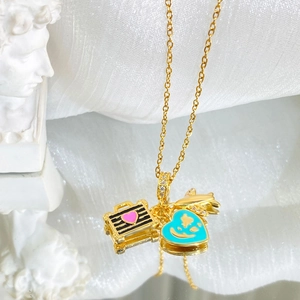 Titanium steel gold necklace with plane, suitcase, and blue heart enamel pendants