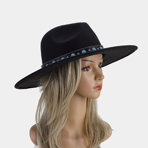Detail of black wide brim fedora with turquoise stones and silver studs decoration
