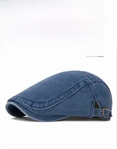 Detailed macro view of navy denim fabric and adjustable metal buckle on the flat cap