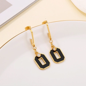 Elegant gold geometric drop earrings with black enamel and sparkling crystal details