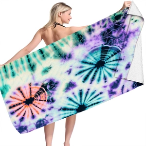 Detailed view of vibrant tie-dye pattern on a large microfiber square beach towel
