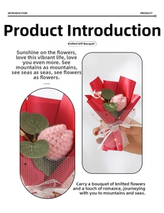 Detail view of pink knitted flower bouquet with green leaves in red gift wrap and tulle