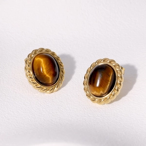 French vintage tiger eye earrings with golden twisted metal frame and oval brown stone