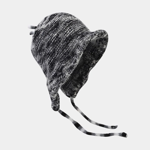 Detailed knit stitch of winter trapper hat in black, white, and grey blend yarn