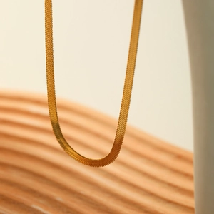 Elegant gold herringbone snake bone chain necklace with a minimalist metallic finish