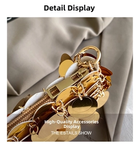 Close-up of sparkling gold sequins and high-quality metal hardware on a mini square bag
