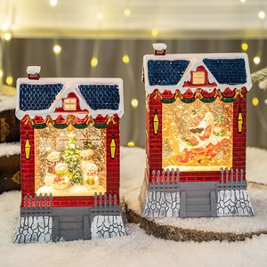 Christmas musical snow globe lanterns with Santa Claus and snowman scenes in warm light