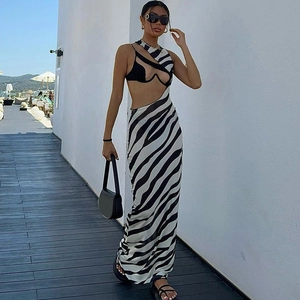 Detail of zebra print sheer mesh dress with asymmetric neckline and waist cut-out