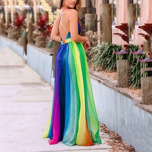 Sexy rainbow gradient chiffon maxi dress with backless criss-cross straps in outdoor setting
