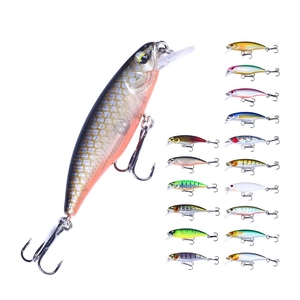 Macro shot of colorful 2.5cm/4g metal micro lures with sharp treble hooks for fishing
