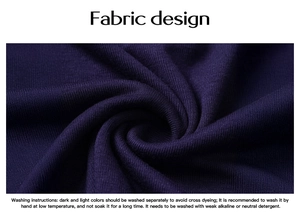 Macro shot of deep purple ribbed knit fabric texture and washing instructions on t-shirt