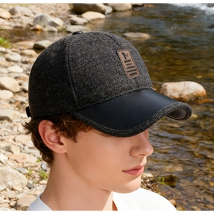 Detail shot of winter baseball cap for men featuring a wool crown and leather brim accent