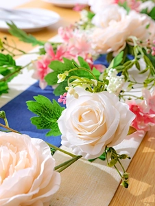 Detailed close-up of realistic silk rose and peony vines for ceiling and wall decoration