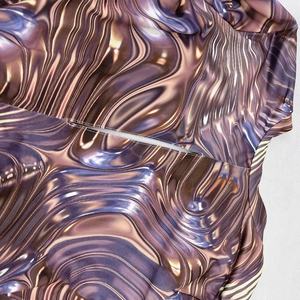 Detail of liquid metal texture fabric with white mesh lining and cut-out stitching