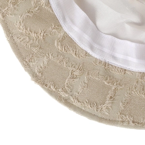 Beige frayed denim bucket hat with plaid texture and breathable white lining detail
