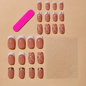 Short press-on nail kit with nude pink finish, french tips, glitter, and glue sticker