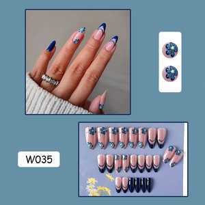 Detail of French blue floral almond press-on nails with 24 pieces and flower patterns