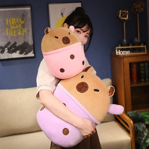 Detailed view of plush capybara toys in pink and purple milk tea cups in two sizes