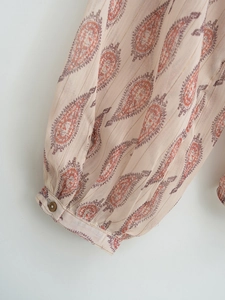French paisley print long sleeve blouse featuring golden metallic threads and cuff detail